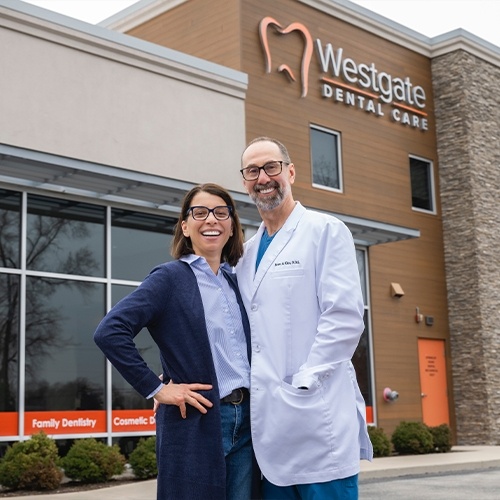 Doctor Kics and his wife standing in front of Westgate Dental Care