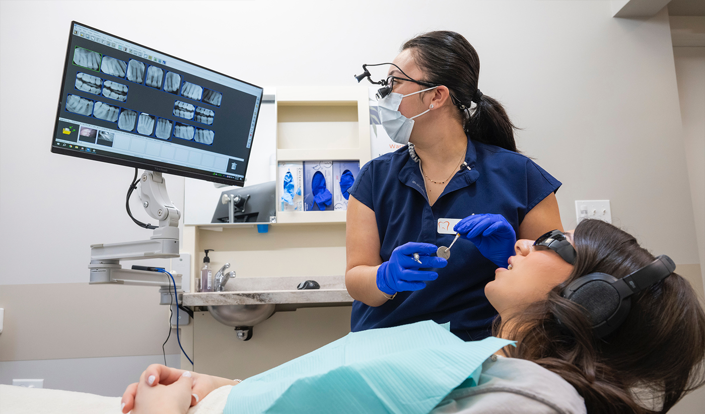 Dentist taking digital scans of a patients teeth