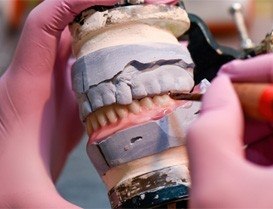 Ceramist creating a denture