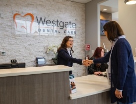 Woman shaking hands with receptionist