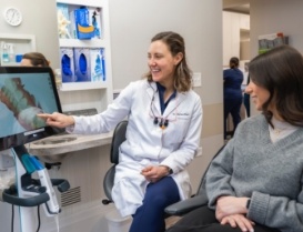 Dentist showing a patient digital models of their teeth