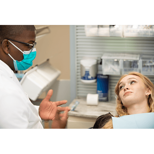 Dentist explaining a procedure to a patient