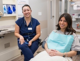 Young woman grinning in dental chair