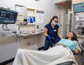 Woman leaning back in dental chair right before treatment