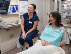 Dental patient and team member looking at screen together