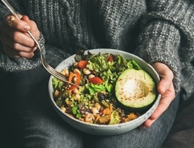 Person eating a salad