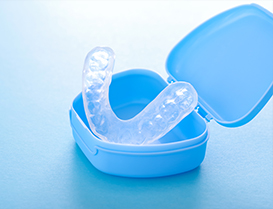 Clear mouthguard in blue case