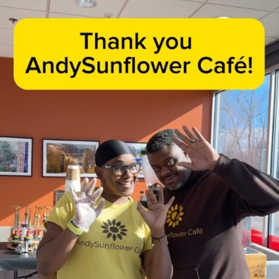 Two smiling people in cafe with text saying Thank You Andy Sunflower Cafe