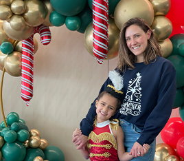 Doctor Hart with her daughter at a Christmas event
