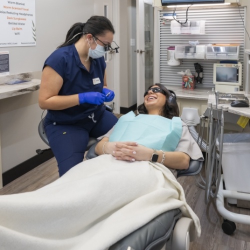 Woman receiving dental treatment