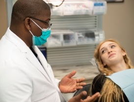 Blonde woman listening to her dentist