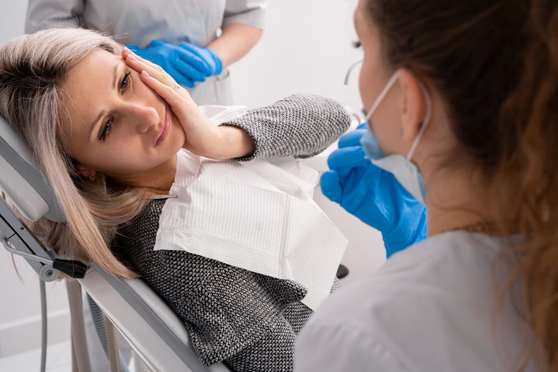 patient experiencing a dental emergency