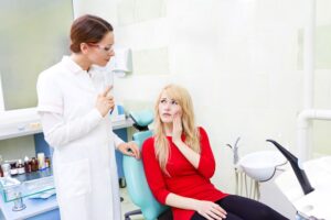 Dentist and patient discussing treatment plan